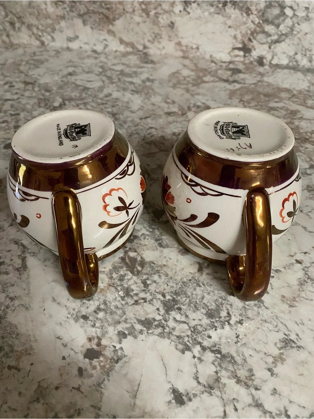 Pair of Cream and Brown Floral Ceramic Creamers with Copper LusterTrim. Vintage